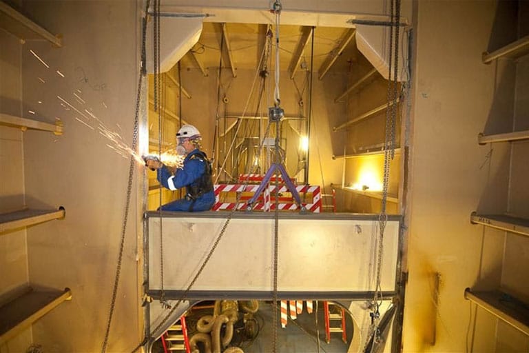 Person making FPSO repairs at a height
