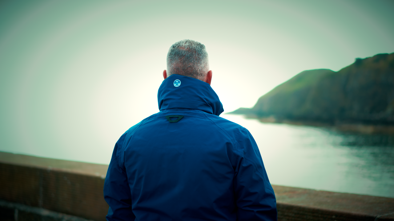 Man looking out to see in deep thought